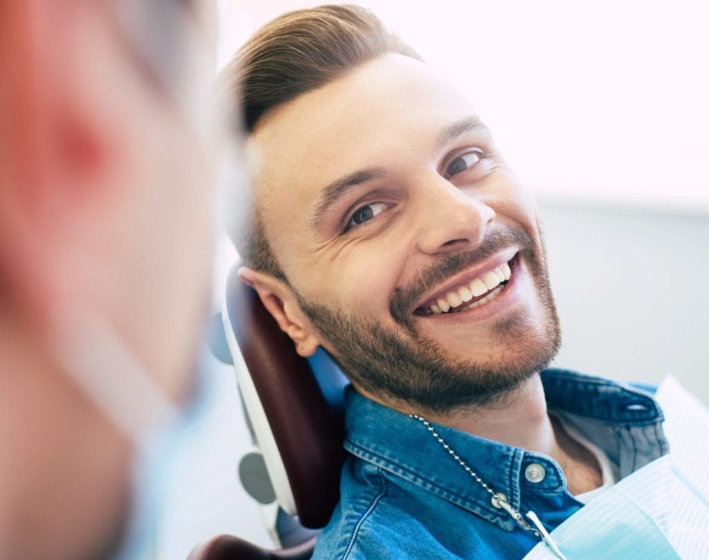 close up of man smiling