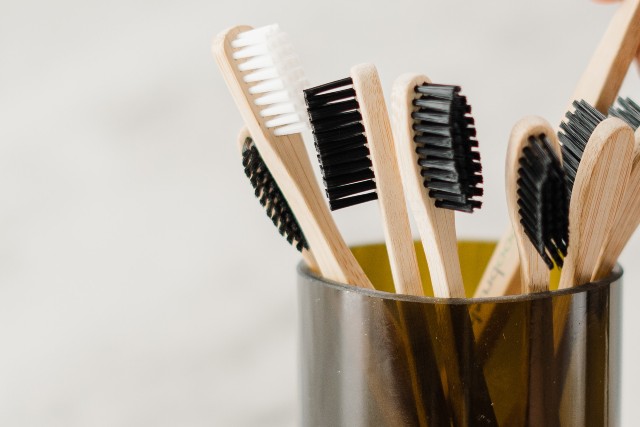 Toothbrushes in black glass