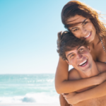 Happy couple in love enjoy summer vacation at beach