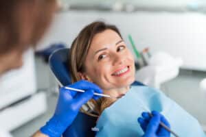 A woman smiling after getting dental crowns in Phoenix, AZ