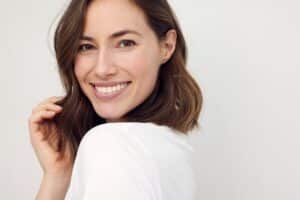 A woman smiling after getting dental bonding in Phoenix