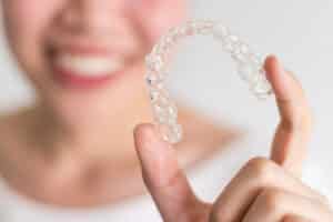 A close-up shot of a SureSmile® aligner in Phoenix